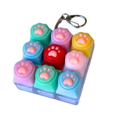 Fidget keyboard senzorická klíčenka 9 tlačítek kočičí tlapky v krabičce